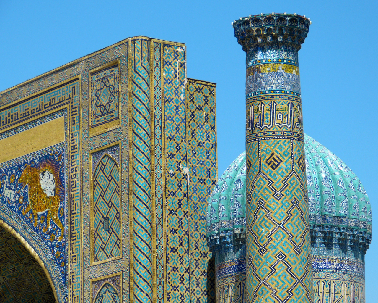 Close-up of intricate tilework and calligraphy on a historic madrasa at Registan Square in Samarkand, Uzbekistan, showcasing Silk Road architecture.
