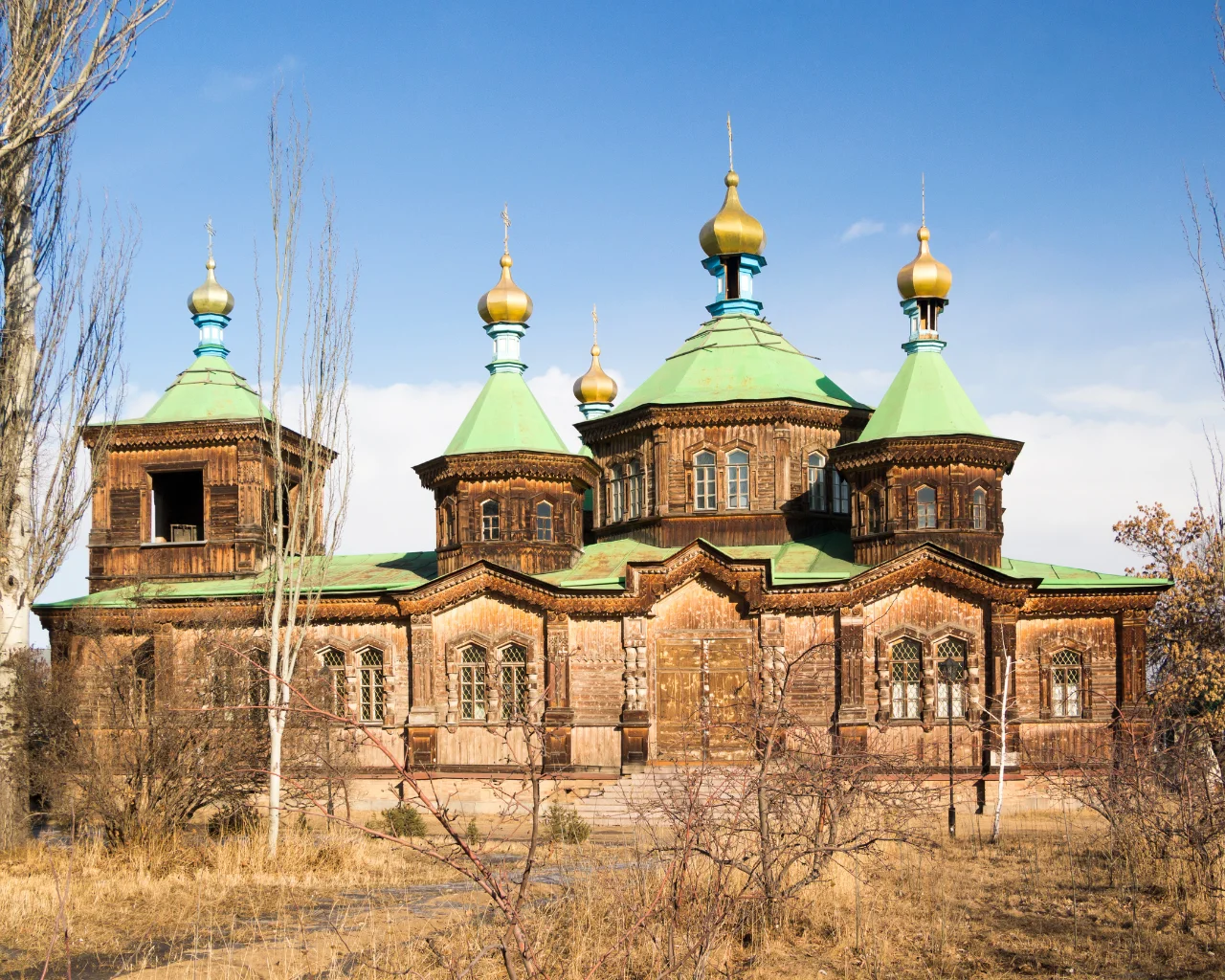 Kyrgyzstan Karakol Church - Wooden Orthodox church with golden domes in Karakol, Kyrgyzstan.