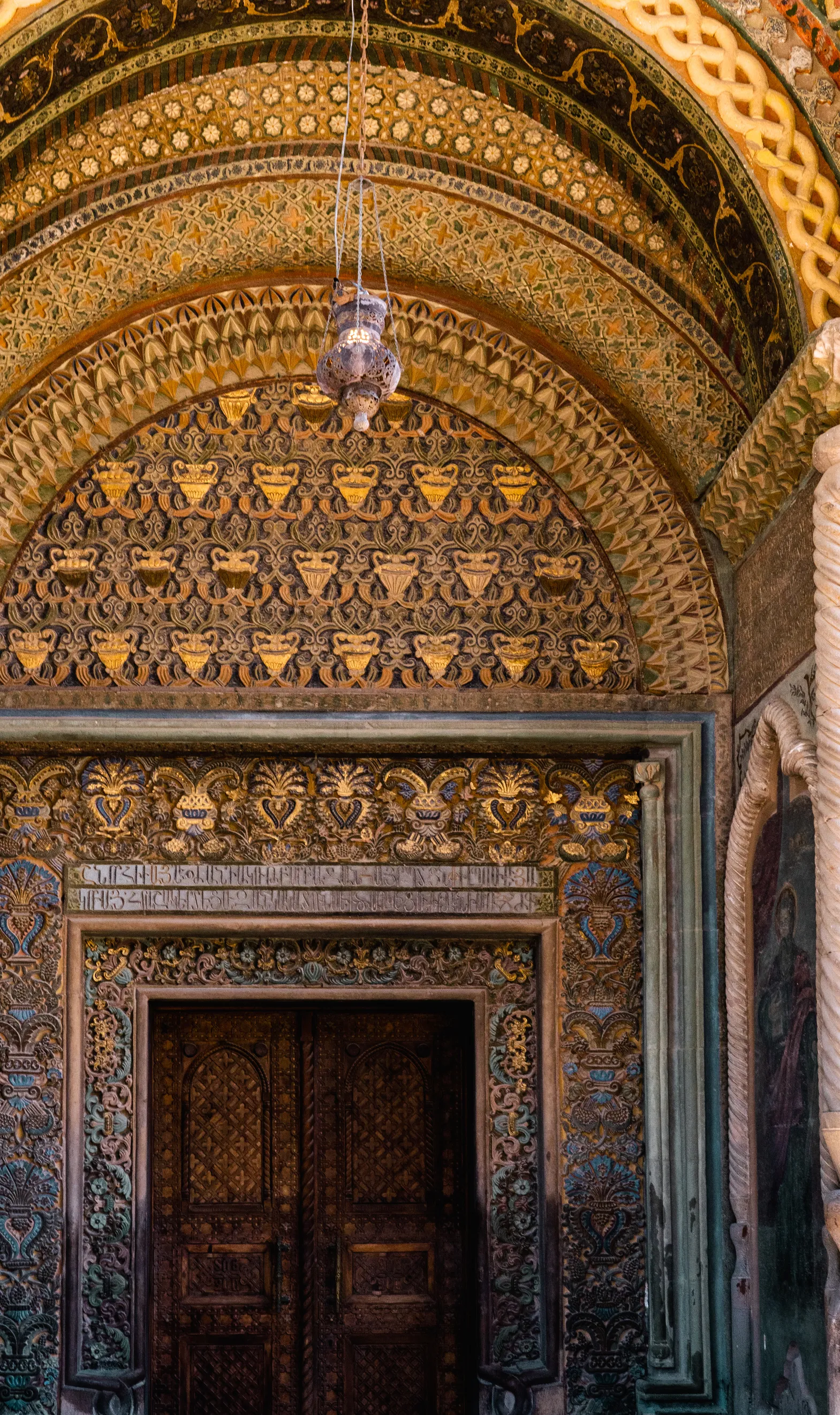 Etchmiadzin Cathedral, the spiritual center of Armenia, with ancient architecture and lush surroundings.