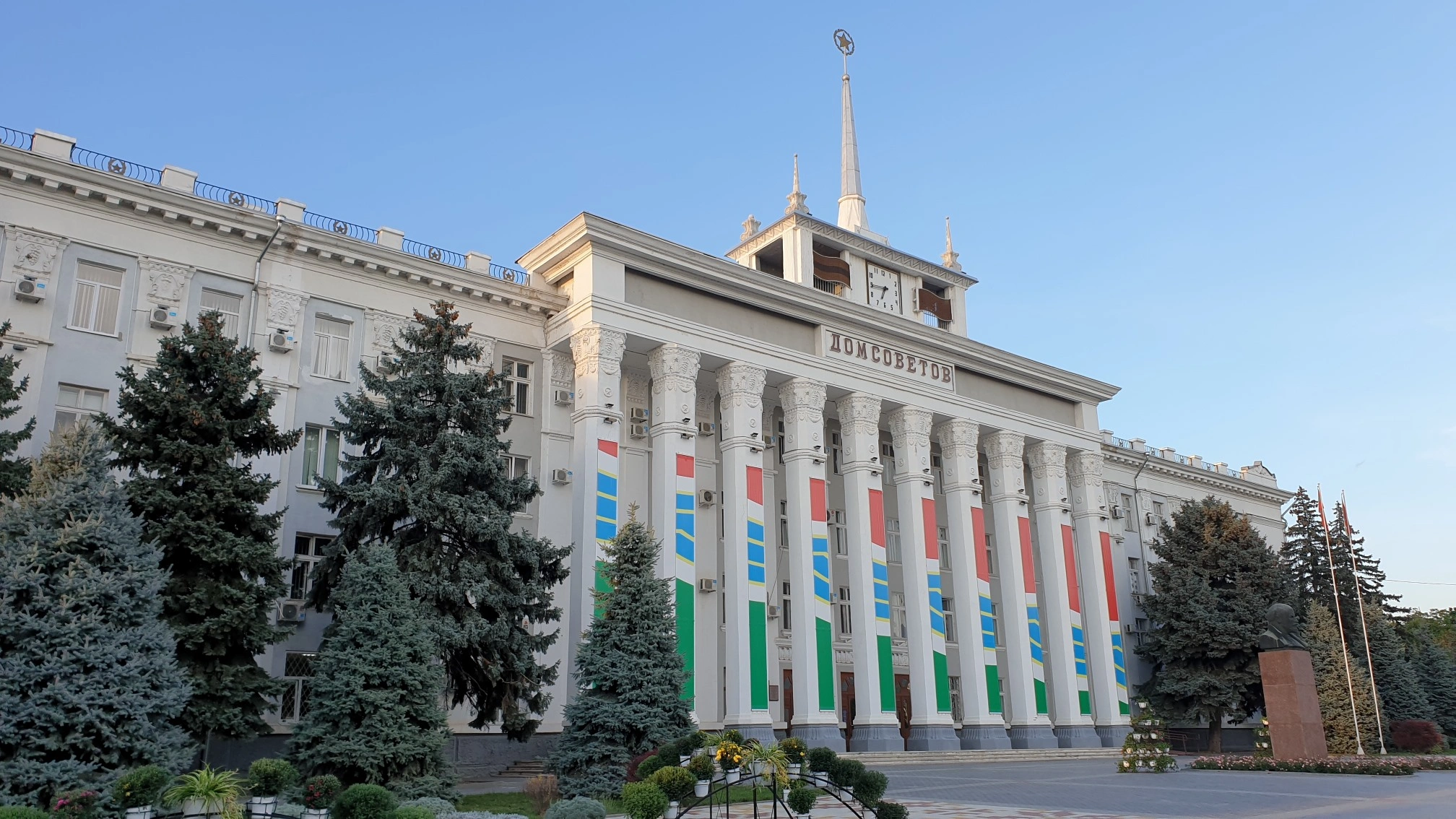 Soviet-style House of Soviets building with flags and columns in Tiraspol, Moldova