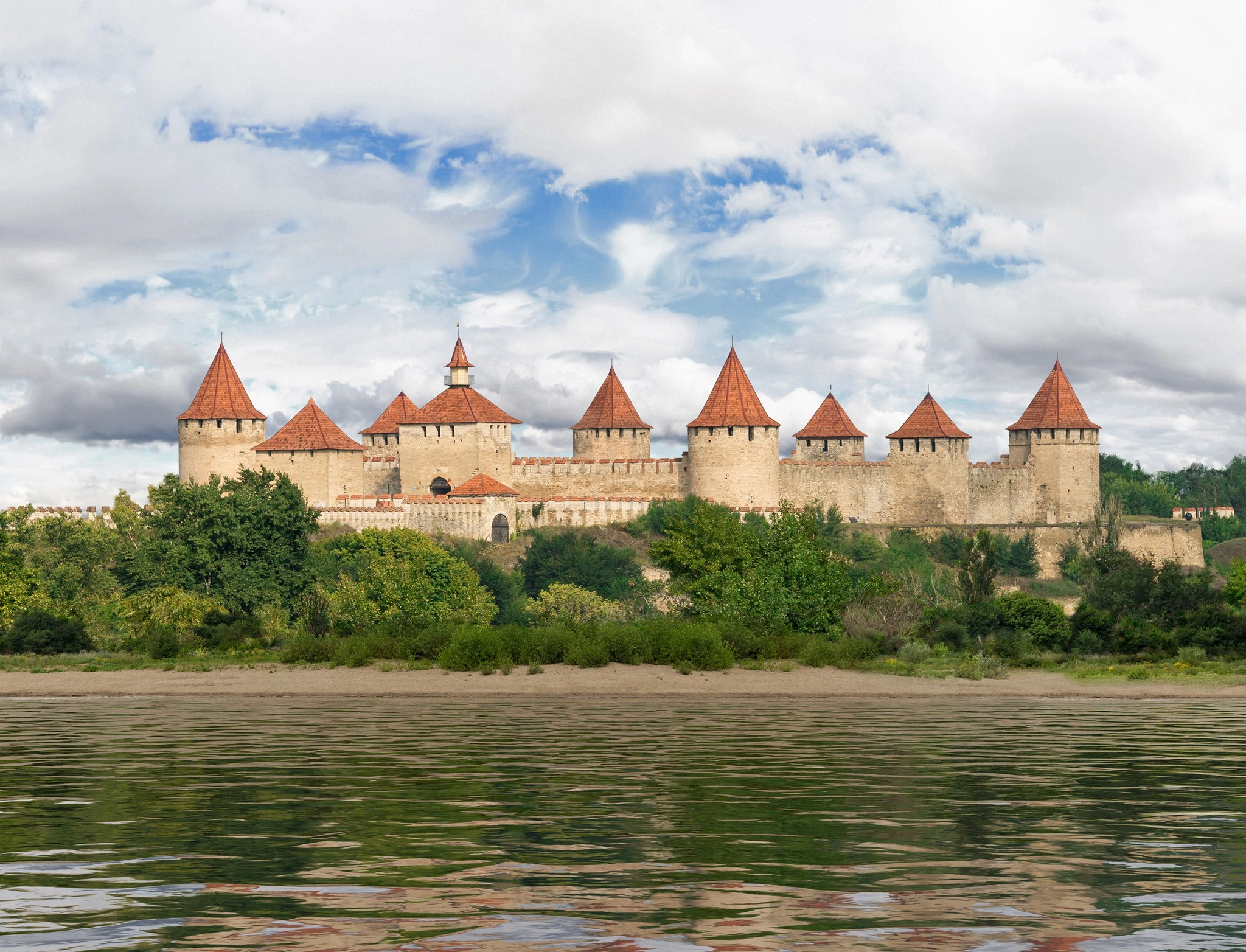 Scenic view of Tighina Fortress with red-roof towers on the Dniester River in Moldova