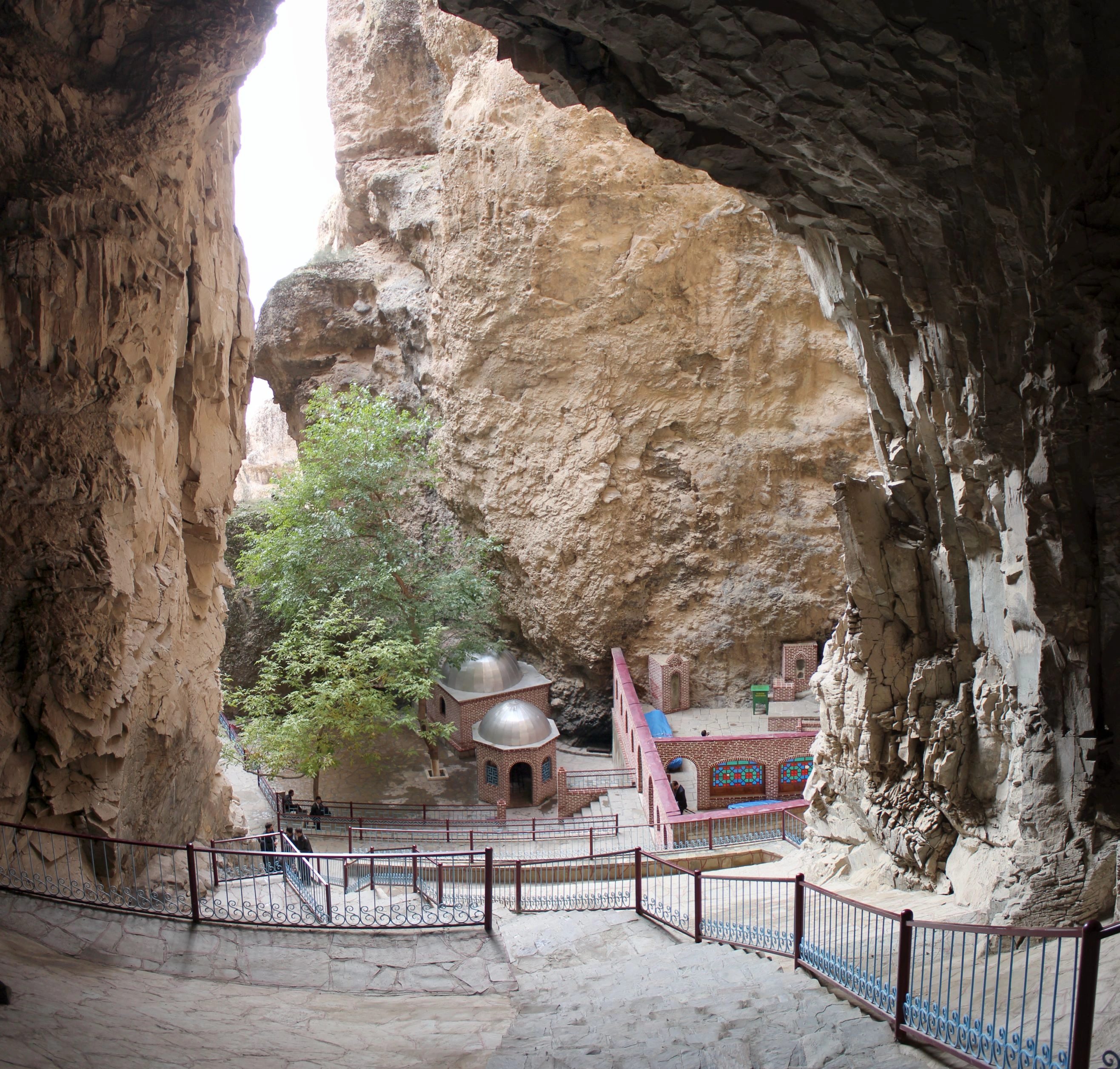 Sunlit Alinja Castle ruins overlook the dry, mountainous valley of Nakhchivan.