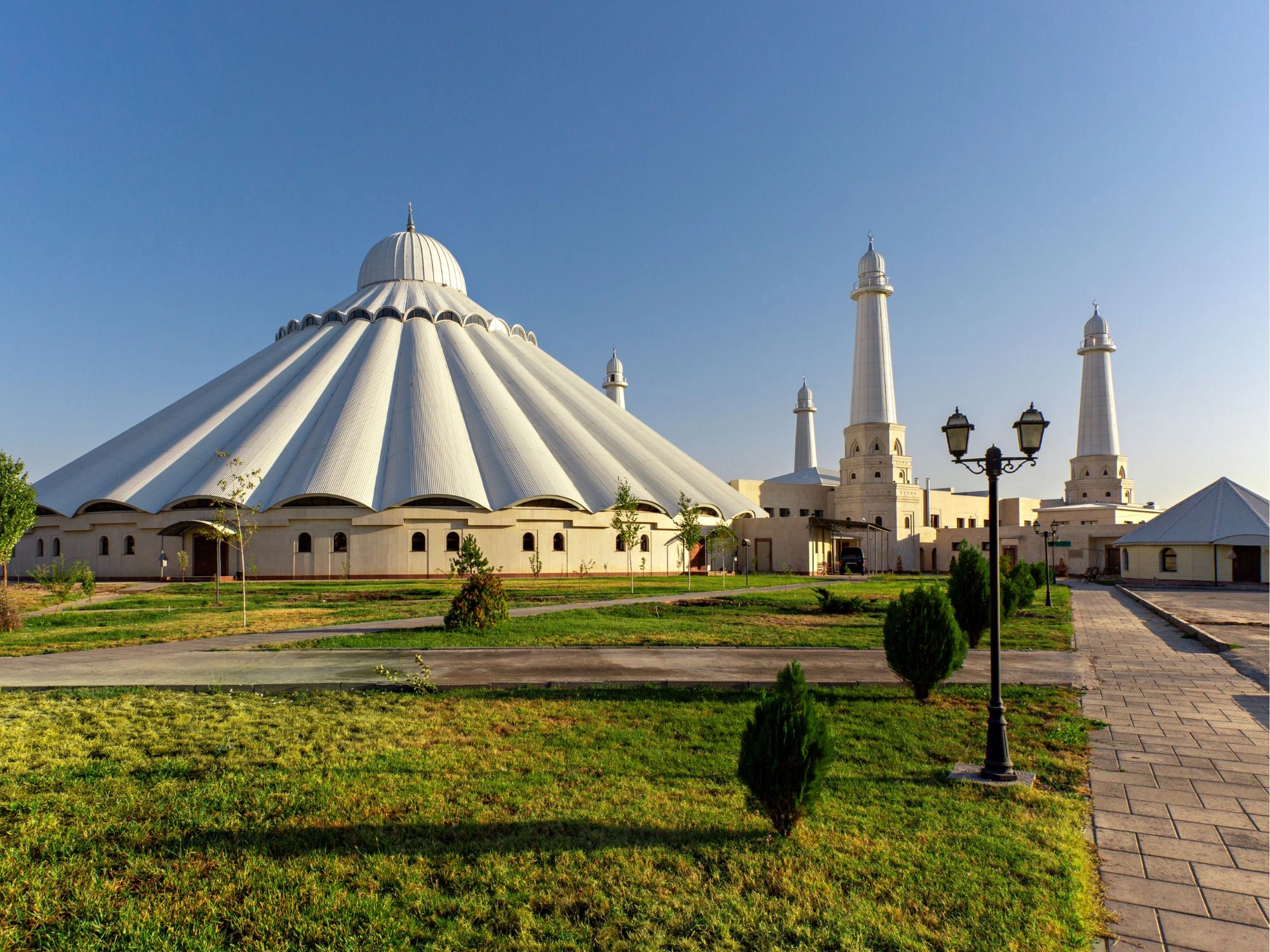 Sheikh Khalifa Mosque in Shymkent with dome-shaped roof and tall white minarets, Kazakhstan