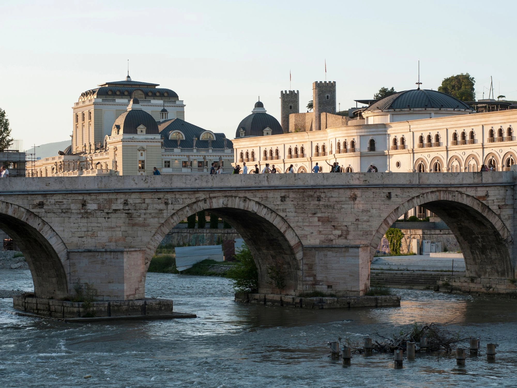 Stone Bridge over Vardar River with Skopje Fortress and neoclassical buildings in Skopje, North Macedonia.