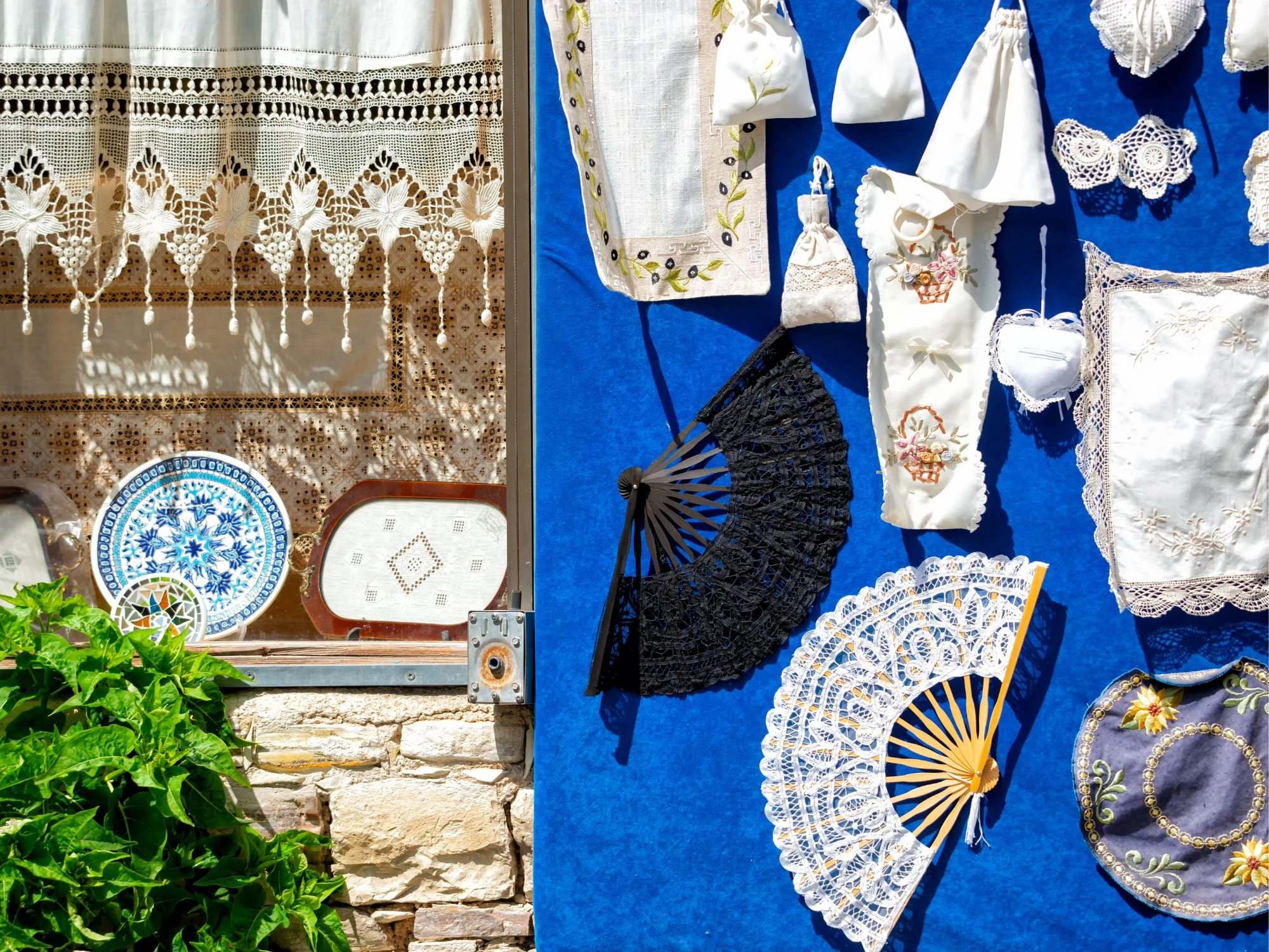 Embroidered lace, fans, and handmade souvenirs in Lefkara village shop, Cyprus.
