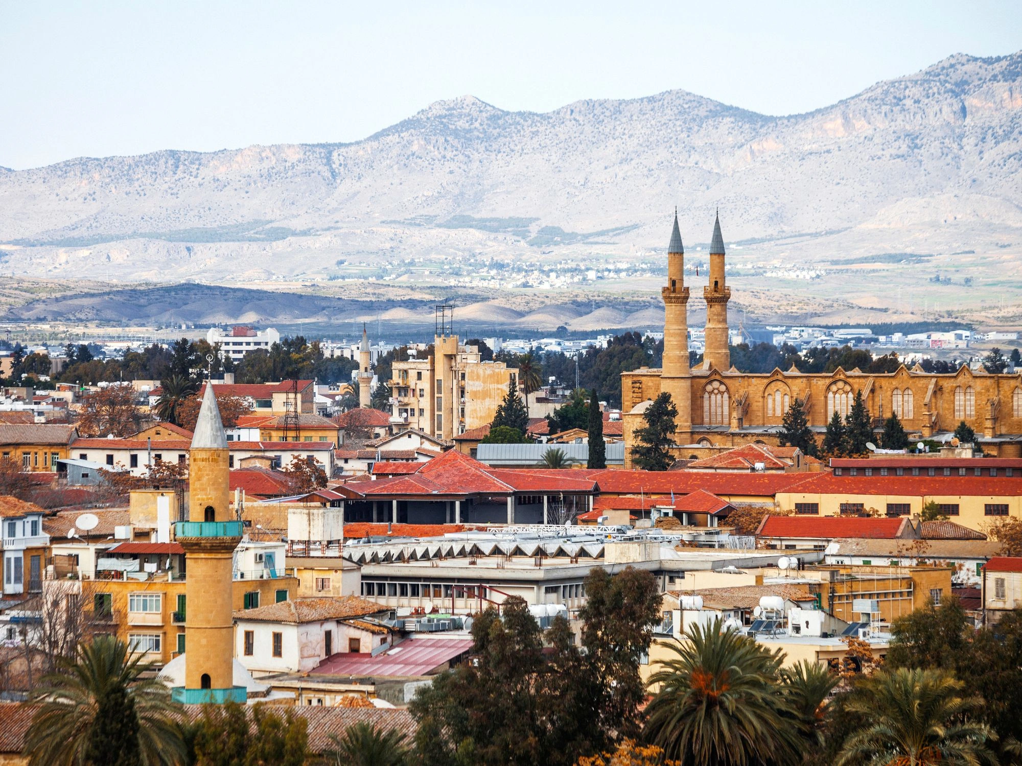 Panoramic view of Nicosia, Cyprus, with minarets and historic architecture.