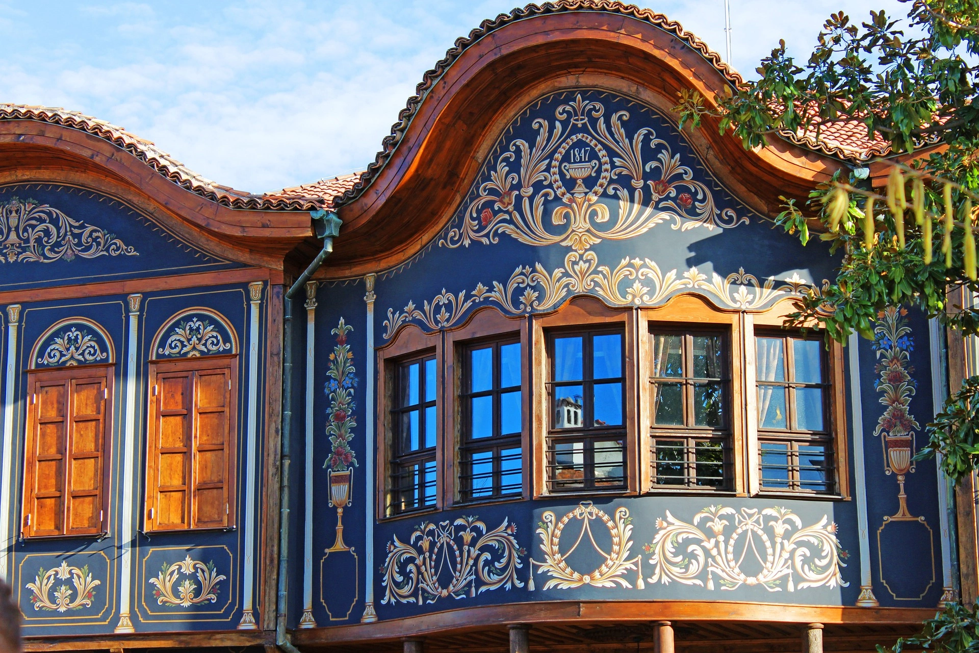 Ornate blue Bulgarian house museum with floral woodwork in Plovdiv Old Town, Bulgaria.