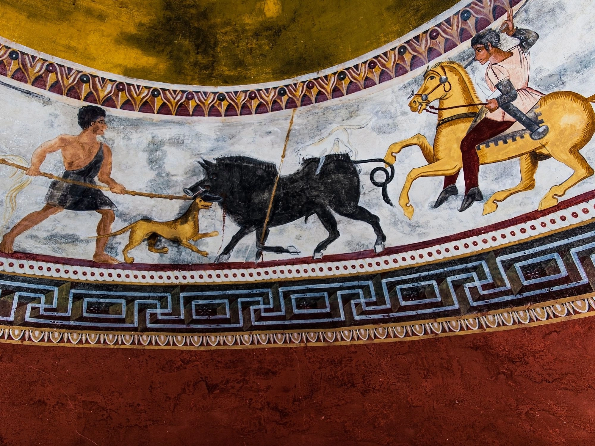 Wall painting of a boar hunt scene with warriors, dogs, and horses in a Thracian tomb.