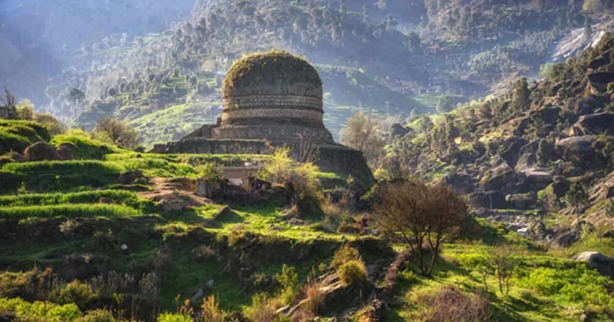 Gandhara Stupa Swat Valley Pakistan, historic Buddhist site in lush green hills.