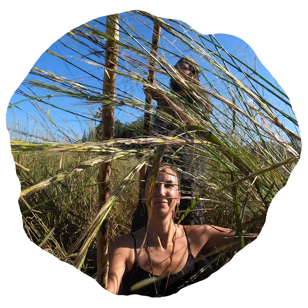 A man wearing a black hat and a black t - shirt.