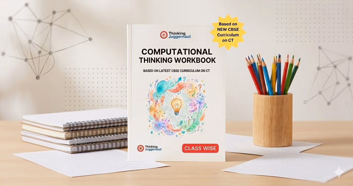 Computational Thinking Workbook by Thinking Juggernaut placed on a desk with colored pencils in a wooden holder and spiral notebooks in the background.