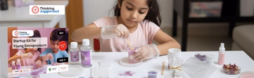 Girl wearing gloves mixing materials at table with Thinking Juggernaut startup kit for young entrepreneurs.