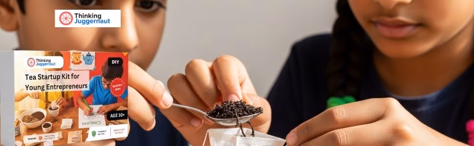 Two children making tea using a spoon and tea leaves from a small kit for young entrepreneurs.