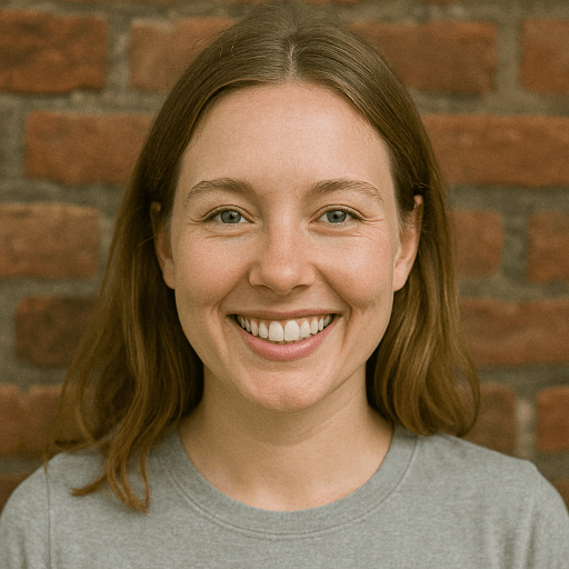 Uploaded selfie of a woman smiling in front of a brick wall to create AI-generated headshots