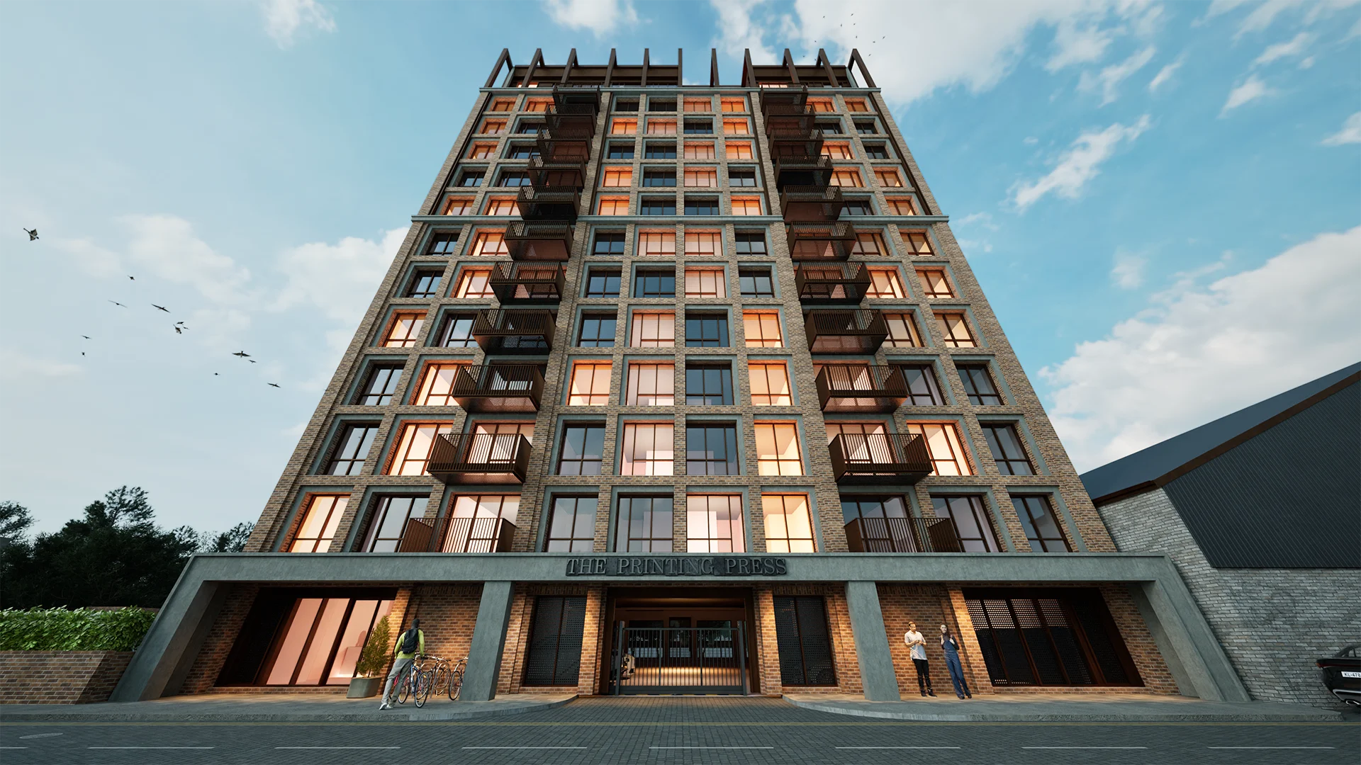 The Printing Press residential development - modern brick apartment tower with balconies and ground floor retail