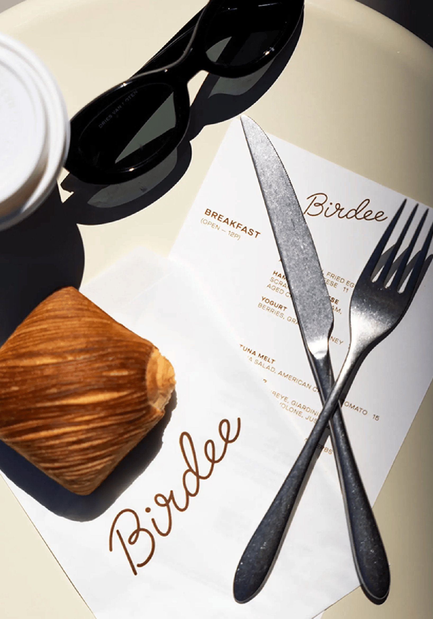 table setup of silverware and Birdee menu