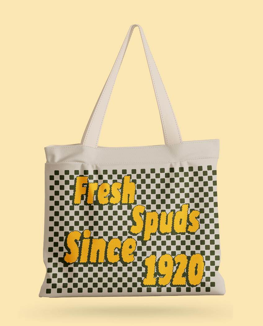cream tote bag with checkerboard pattern and "fresh spuds since 1920" text