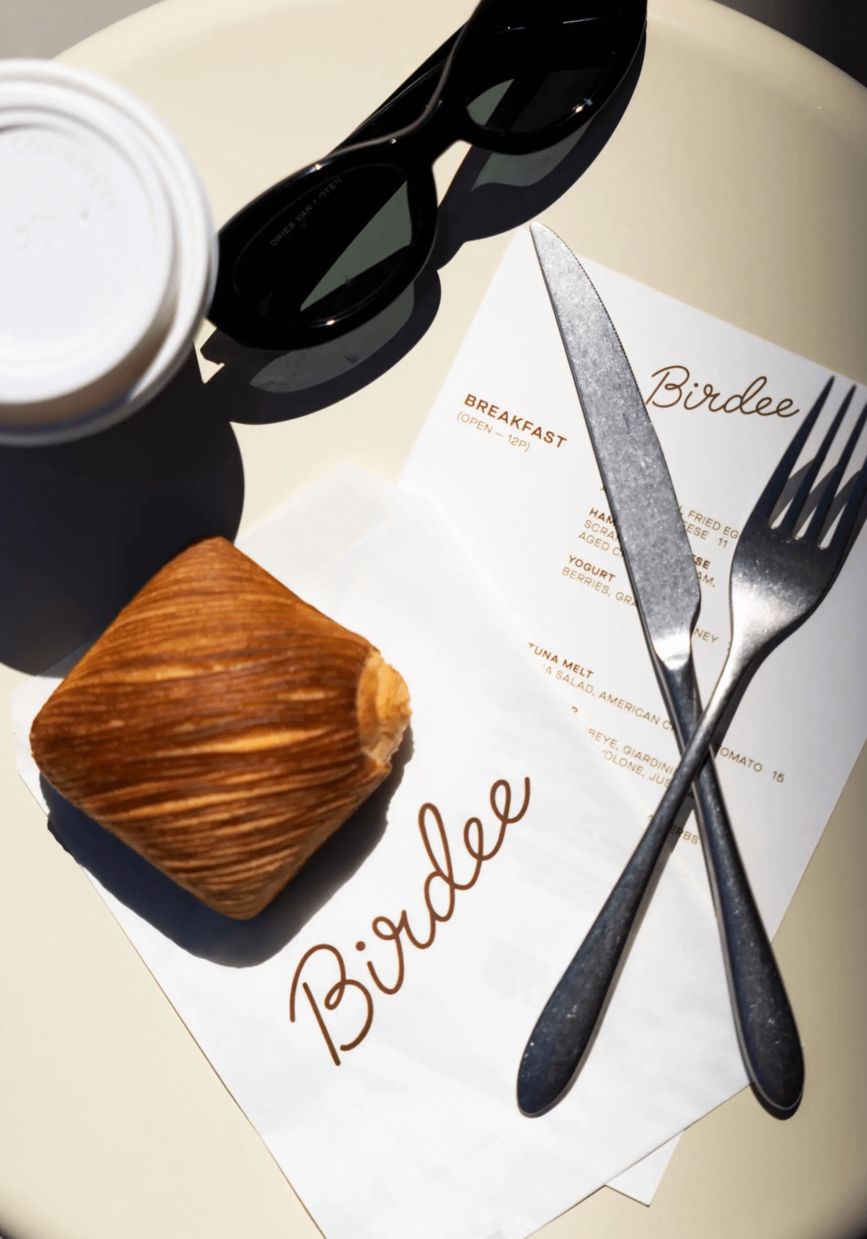 table setup of silverware and Birdee menu