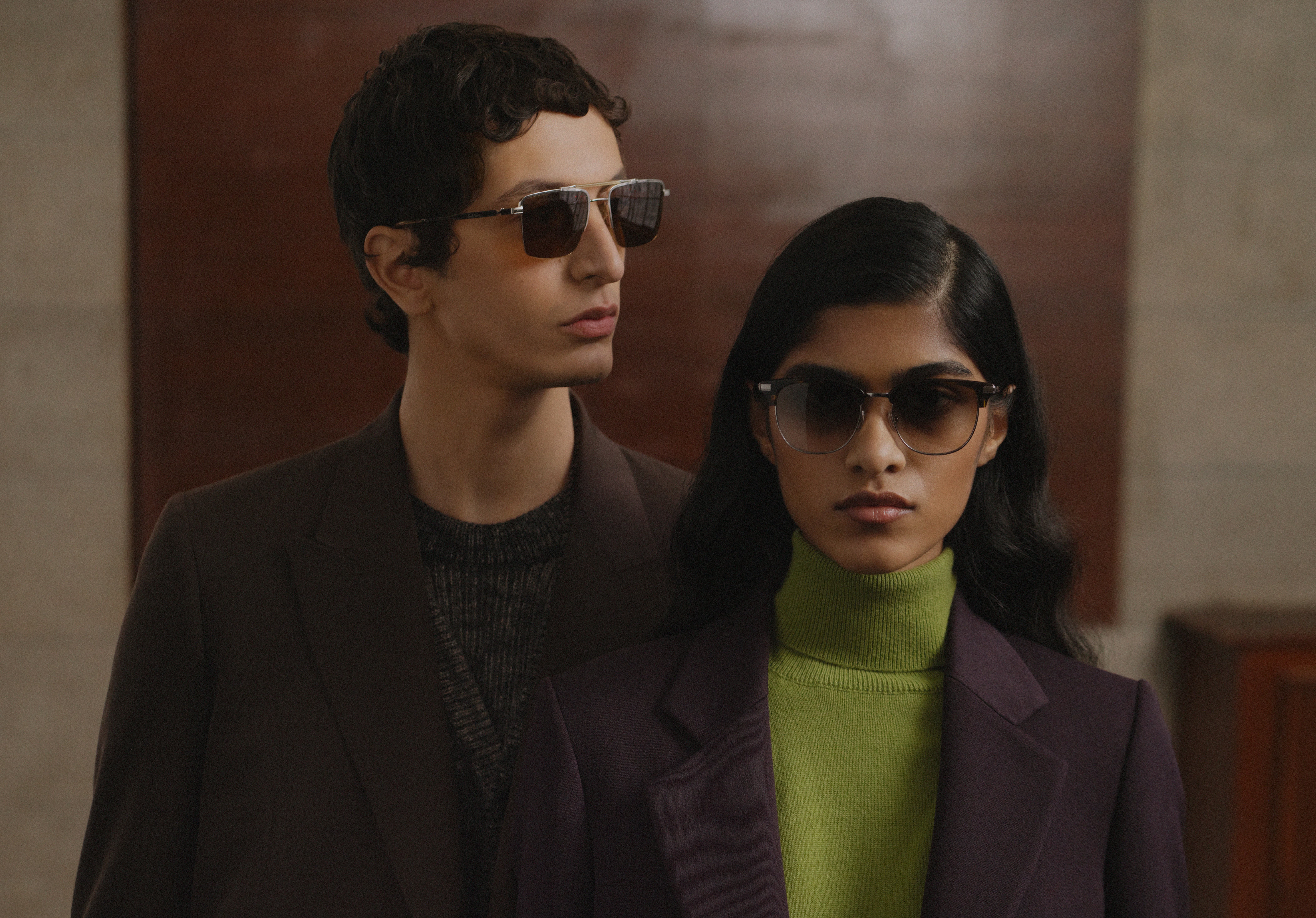 Couple wearing designer glasses