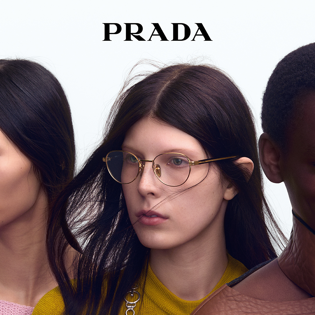 Three women wearing stylish eyeglasses against white background with Prada logo