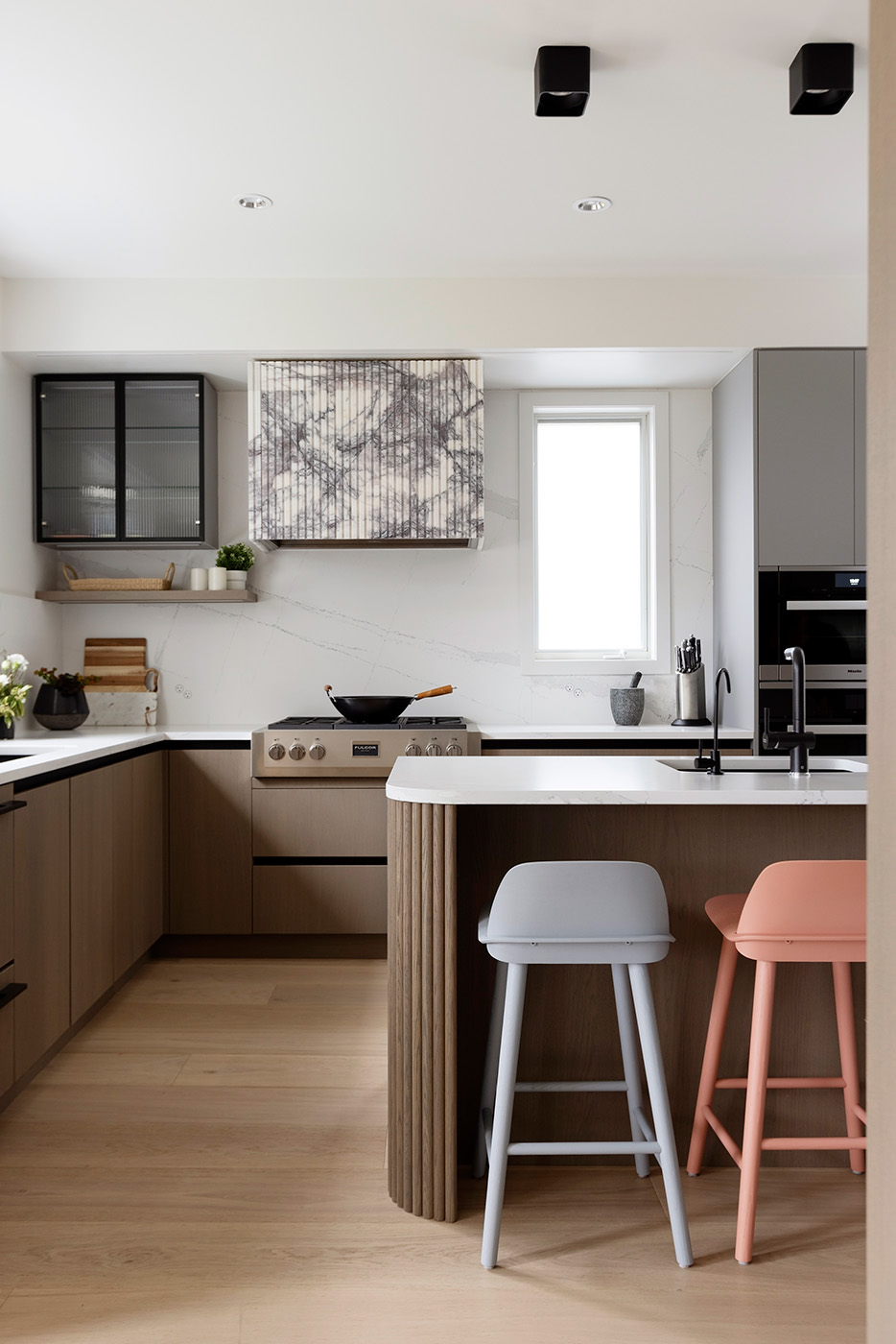 modern kitchen with oak cabinets and white countertops