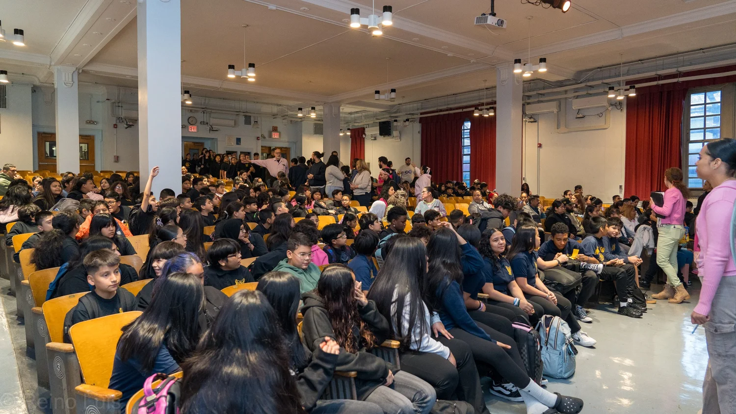 Students filling auditorium seats during a school award ceremony
