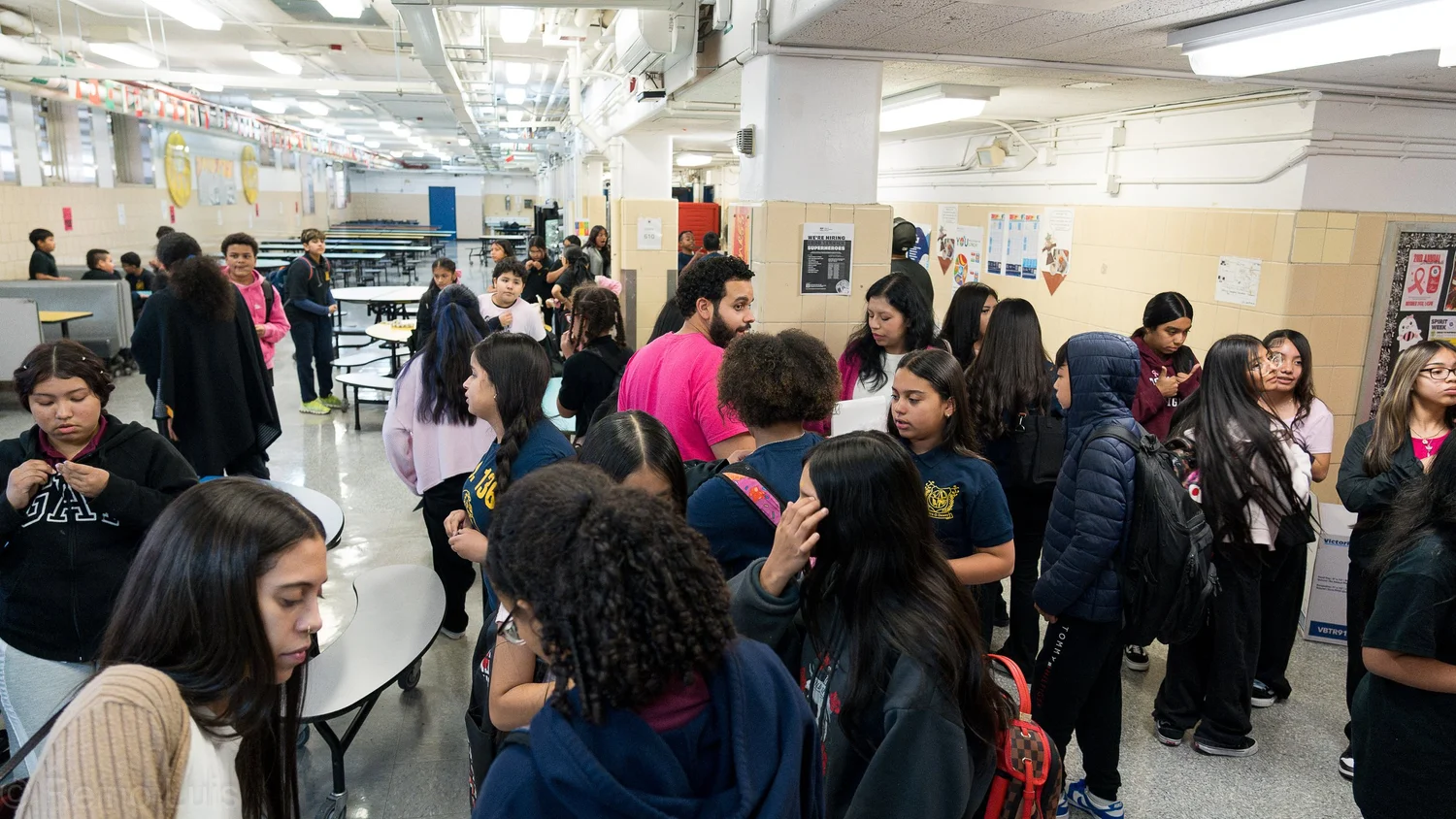 Students and staff gathered in the school cafeteria during lunch