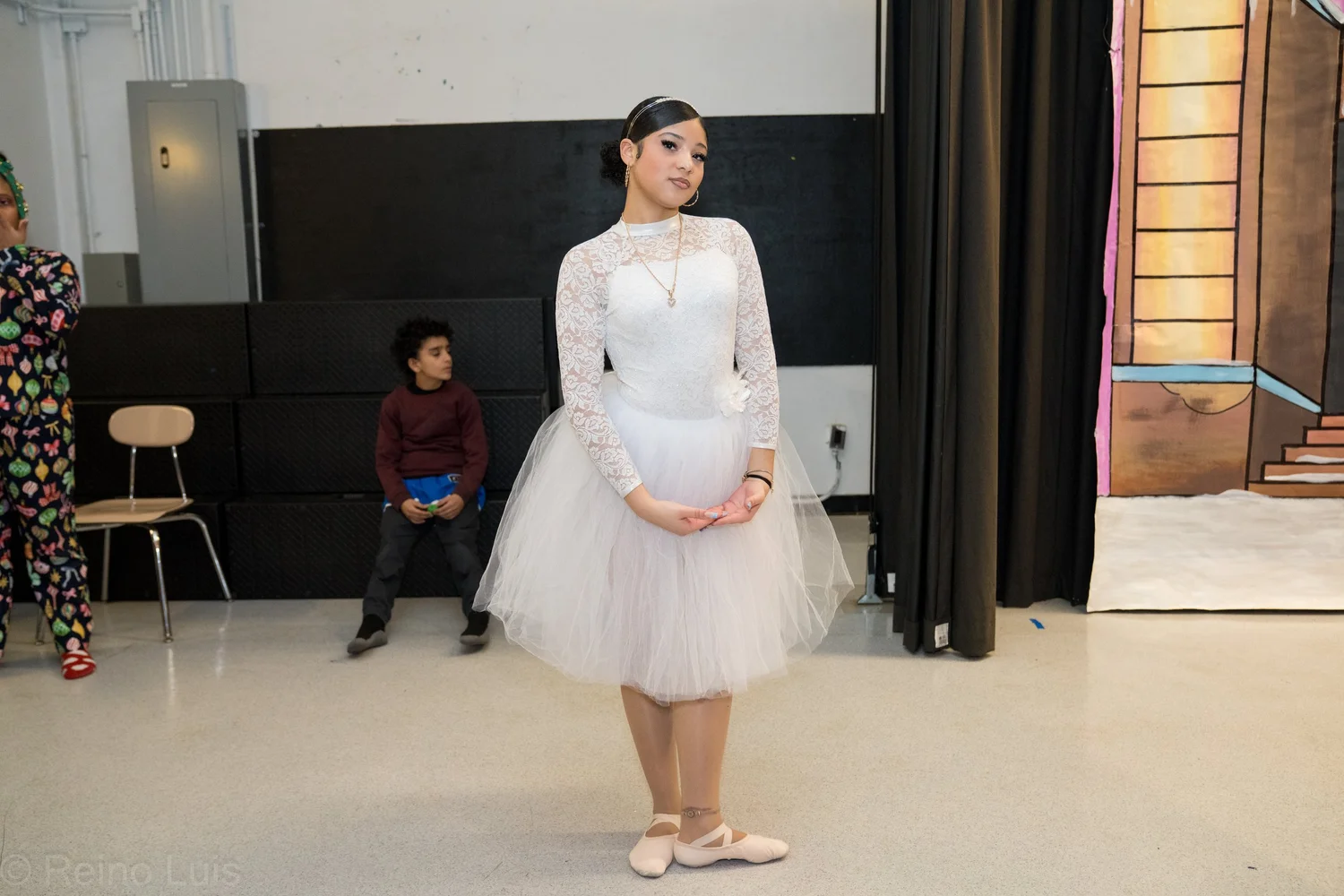 Student in white tulle costume performs during school dance recital