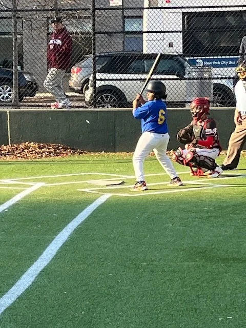 Student batter number 6 at plate during baseball game