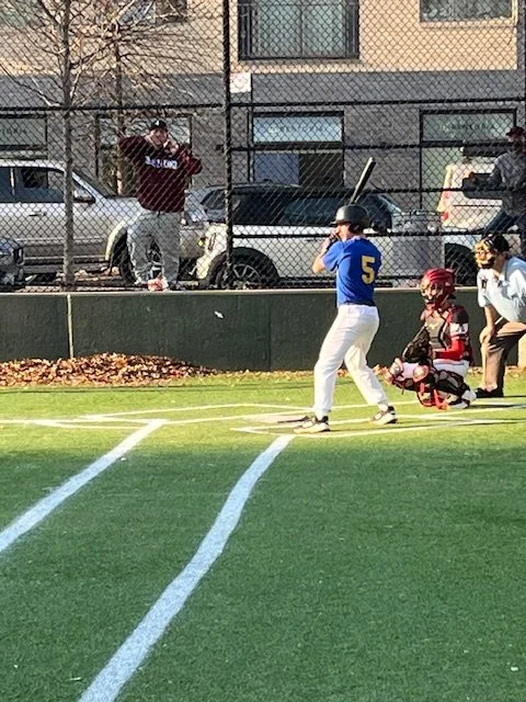 Student batter number 5 at plate during baseball game