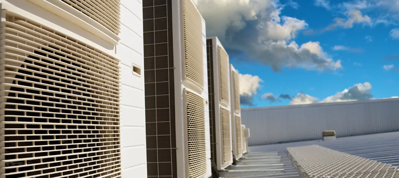 Row of VRV outdoor units on a commercial rooftop.