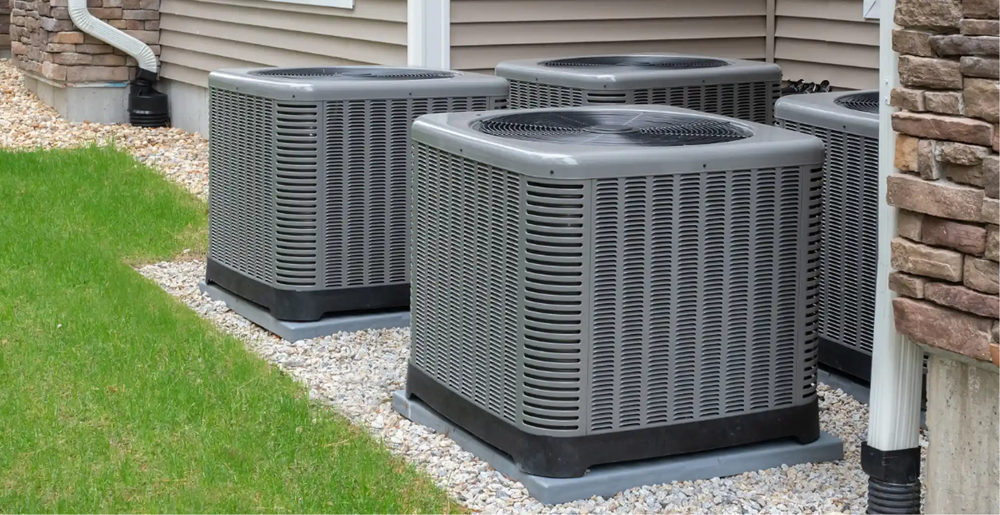 Outdoor heat pump units installed next to a home