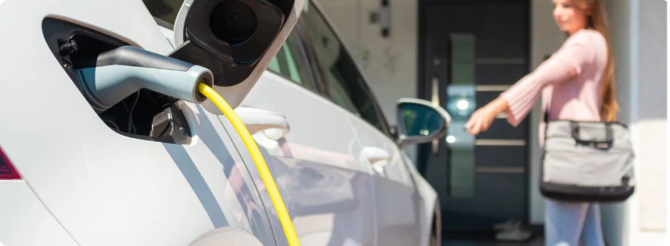  Electric vehicle charging at a home charging station.