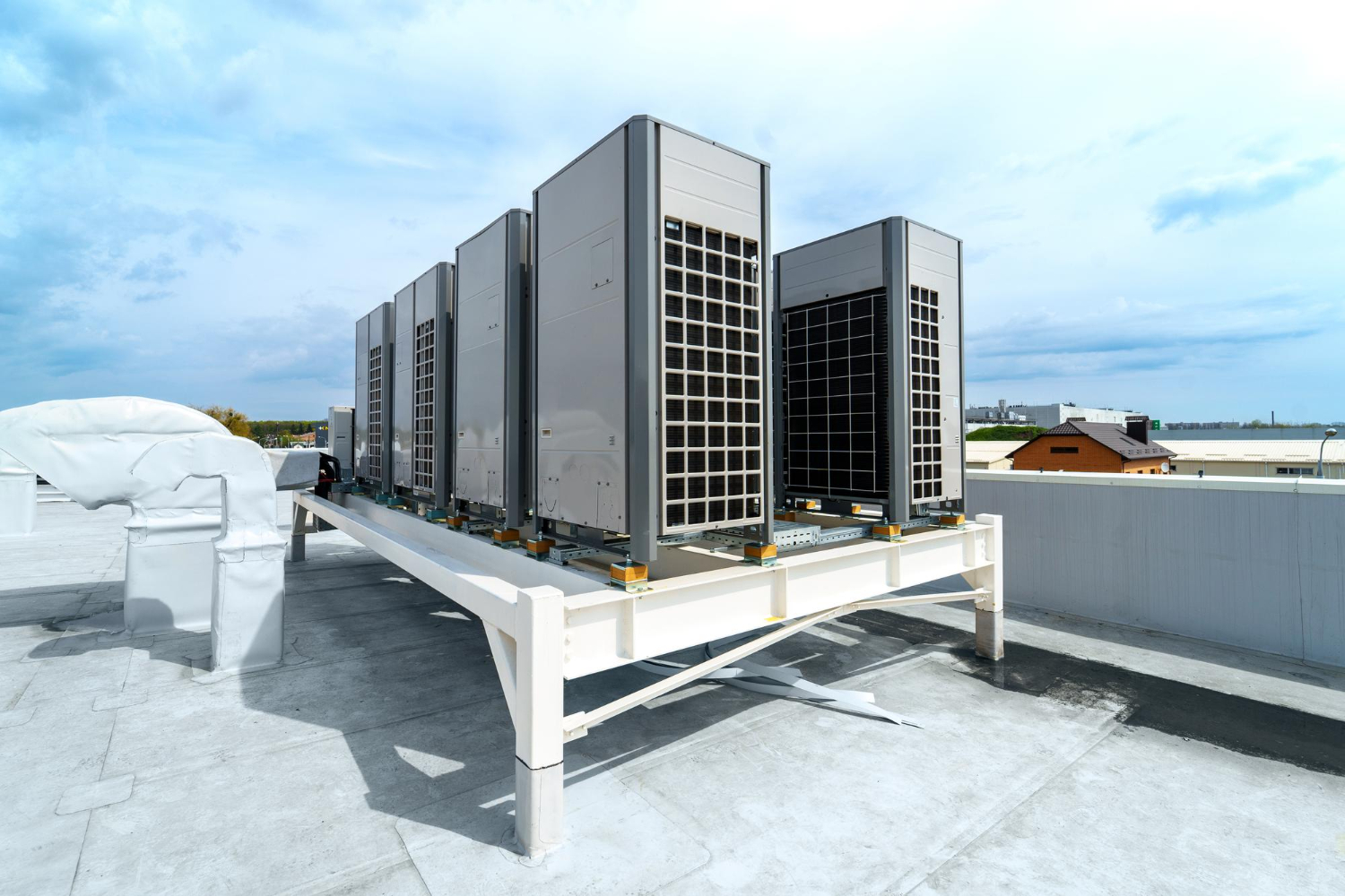 Row of VRV outdoor units on a commercial rooftop.