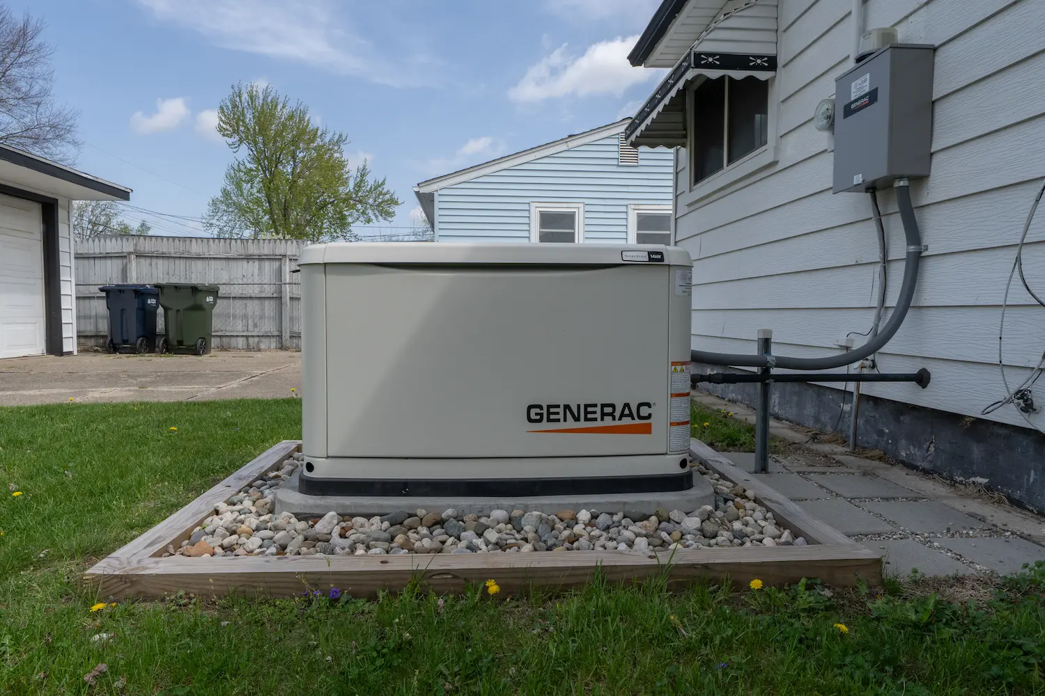 Generac standby generator beside house