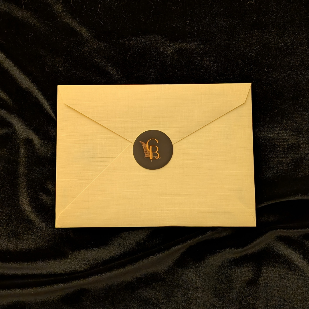 The Curator's Bazaar's letter sitting atop black velvet.