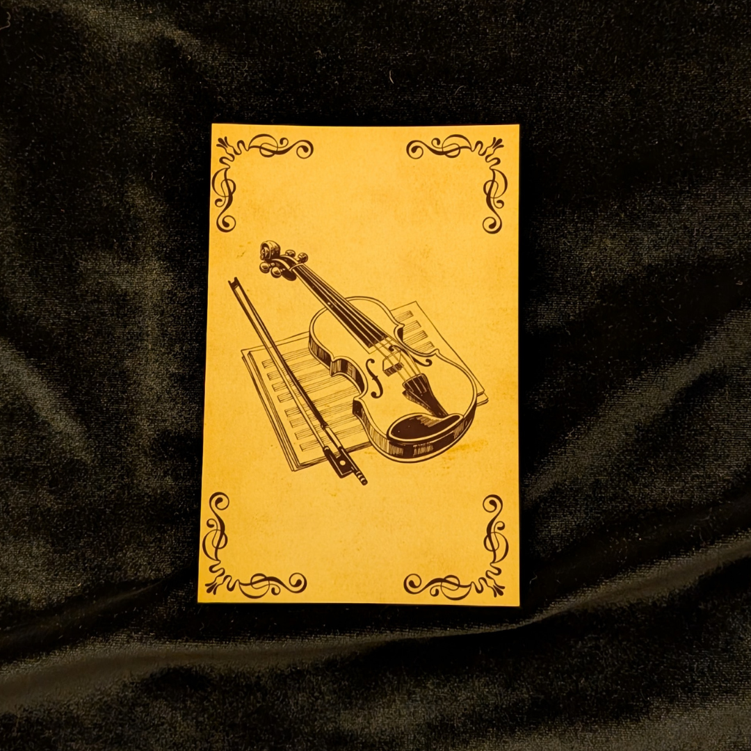 The Curator's Bazaar's music card sitting atop black velvet.