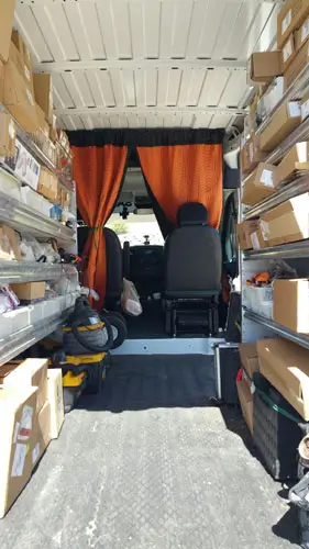 Picture of inside on of Mr Eds Service trucks - filled wall to wall with parts.