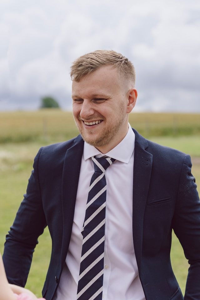 [headshot] image of satisfied customer shaking hands with company representative (for a fintech company)