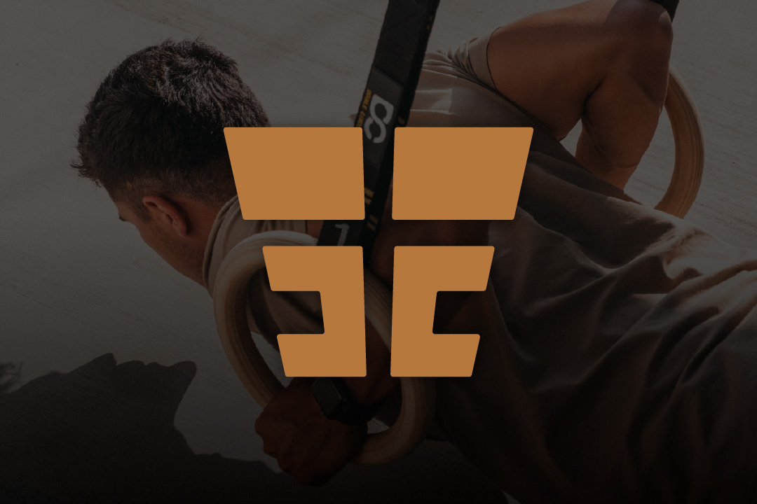 Bold calisthenics personal trainer logo design displayed over athlete using Olympic rings for bodyweight training