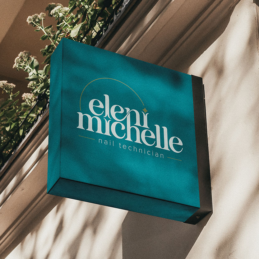Eleni Michelle nail technician storefront sign mockup showcasing elegant white and gold logo on teal background for beauty service branding