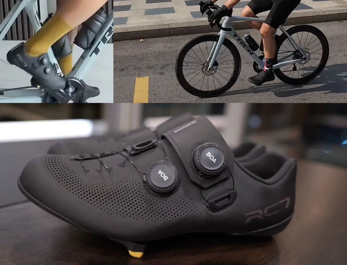 Black Shimano RC7 road cycling shoes with dual BOA dial closure system displayed on a table with a yellow cleat visible on the carbon sole