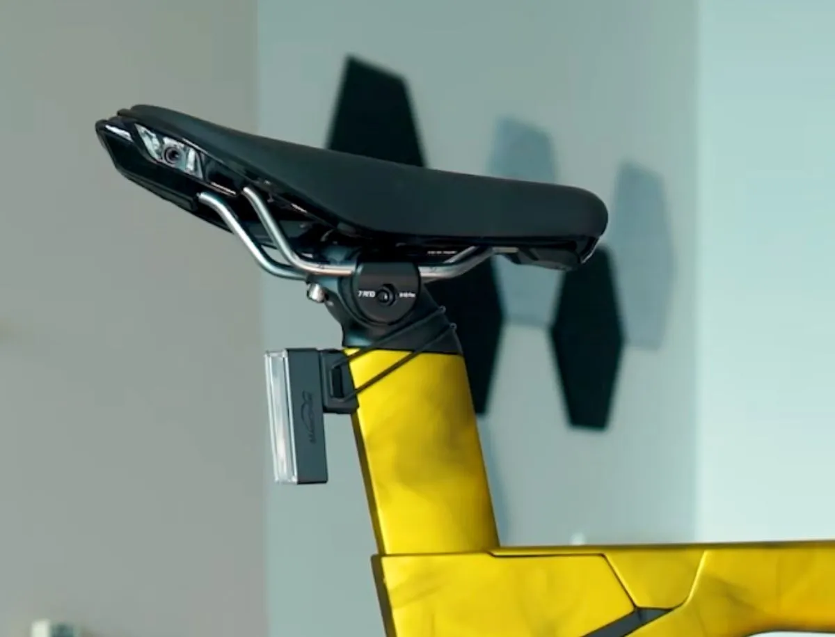 Bontrager Hilo Comp saddle mounted on Trek Speed Concept SL7 Project One yellow carbon seatpost with rear light attached