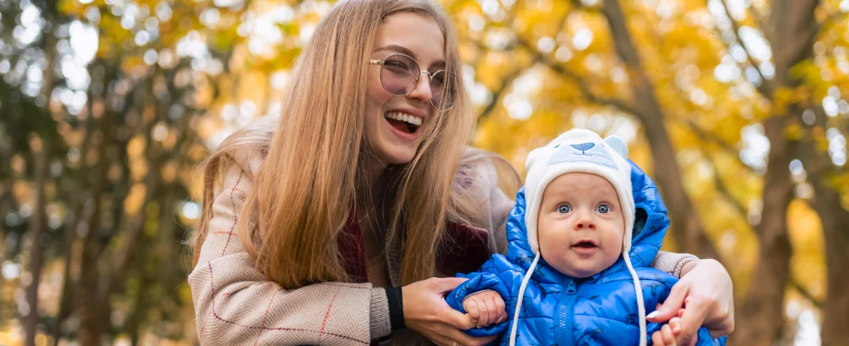 A mom with her kid in a park