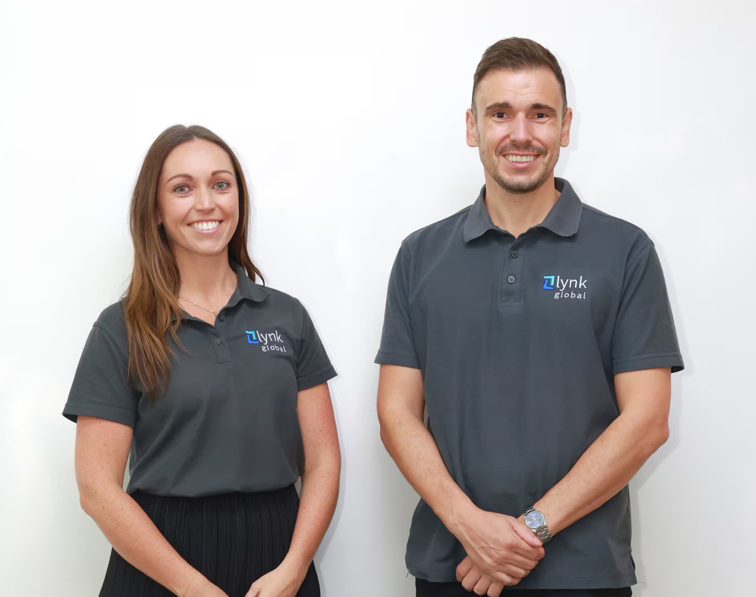 Lynk Global team members working at their desks in the office, providing bookkeeping and admin support services