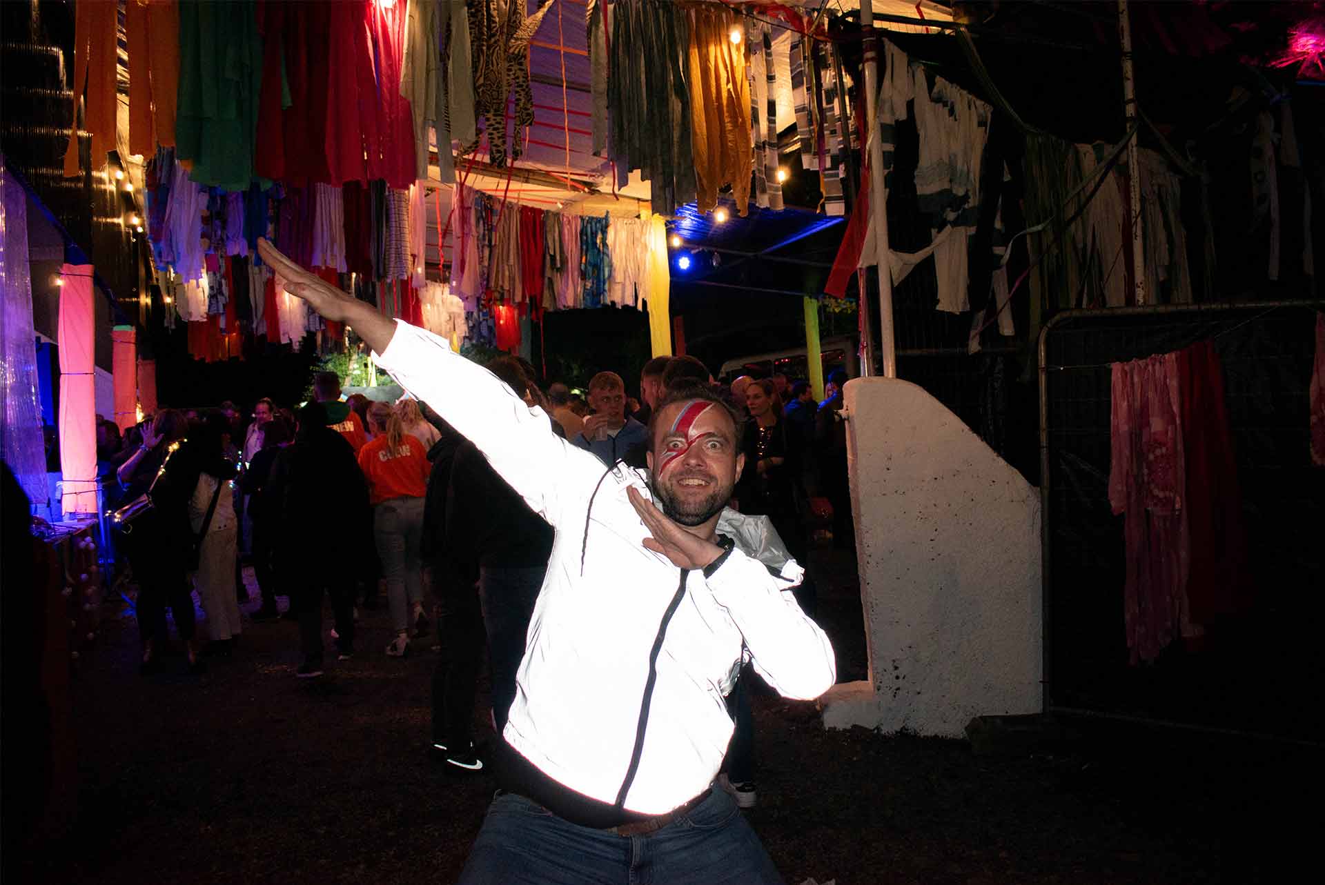A happy festival goer makes some shapes at Full Moon Rising festival