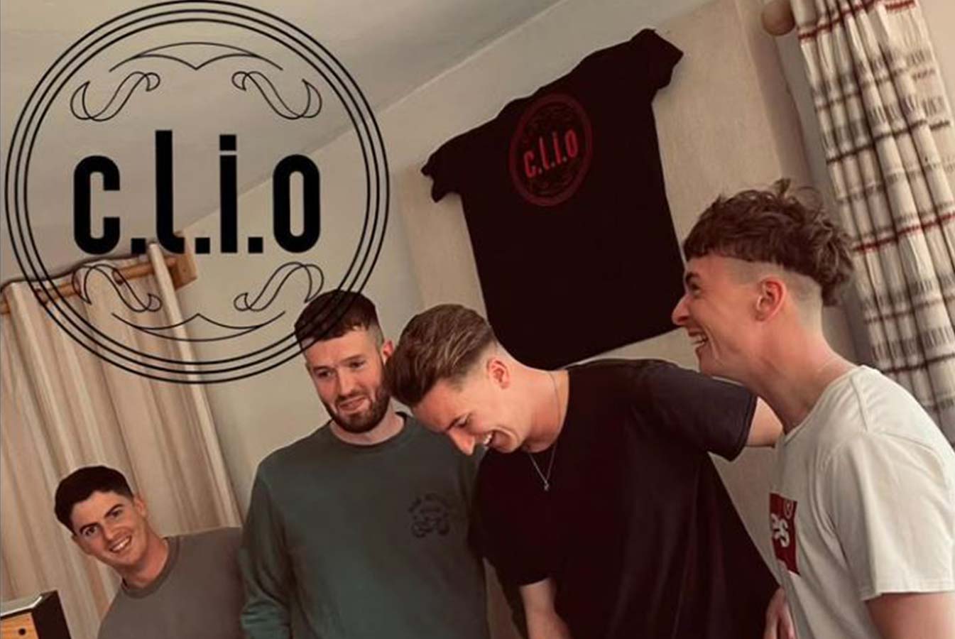 The four members of the Clio band laugh and pose for the camera