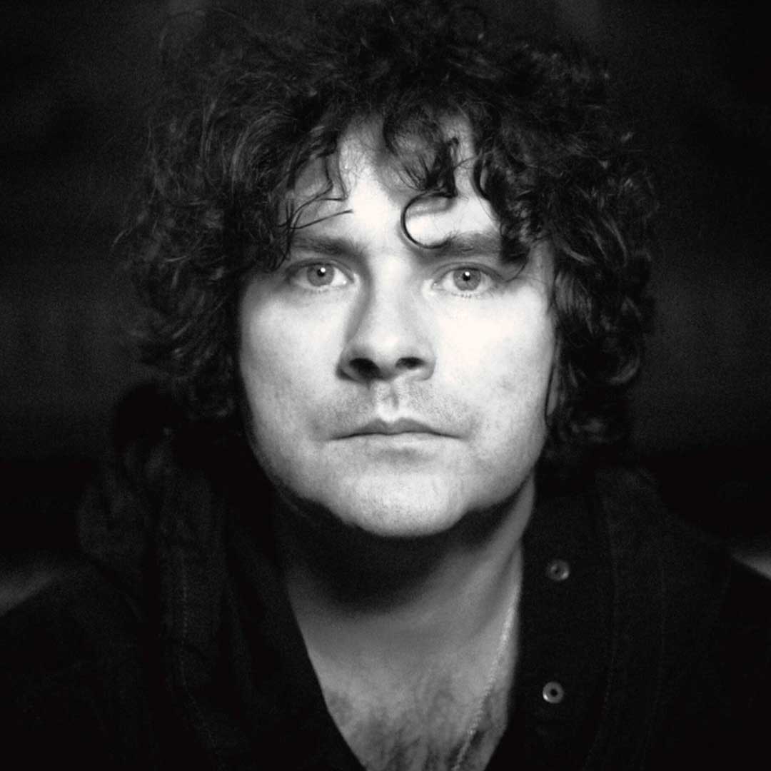 A portrait photograph of award-winning Irish artist and icon Paddy Casey