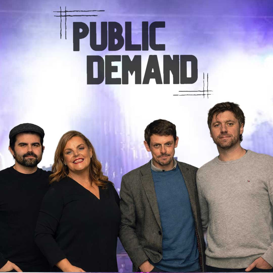 Four adults standing side by side in front of a purple background with the text 'PUBLIC DEMAND' above them.