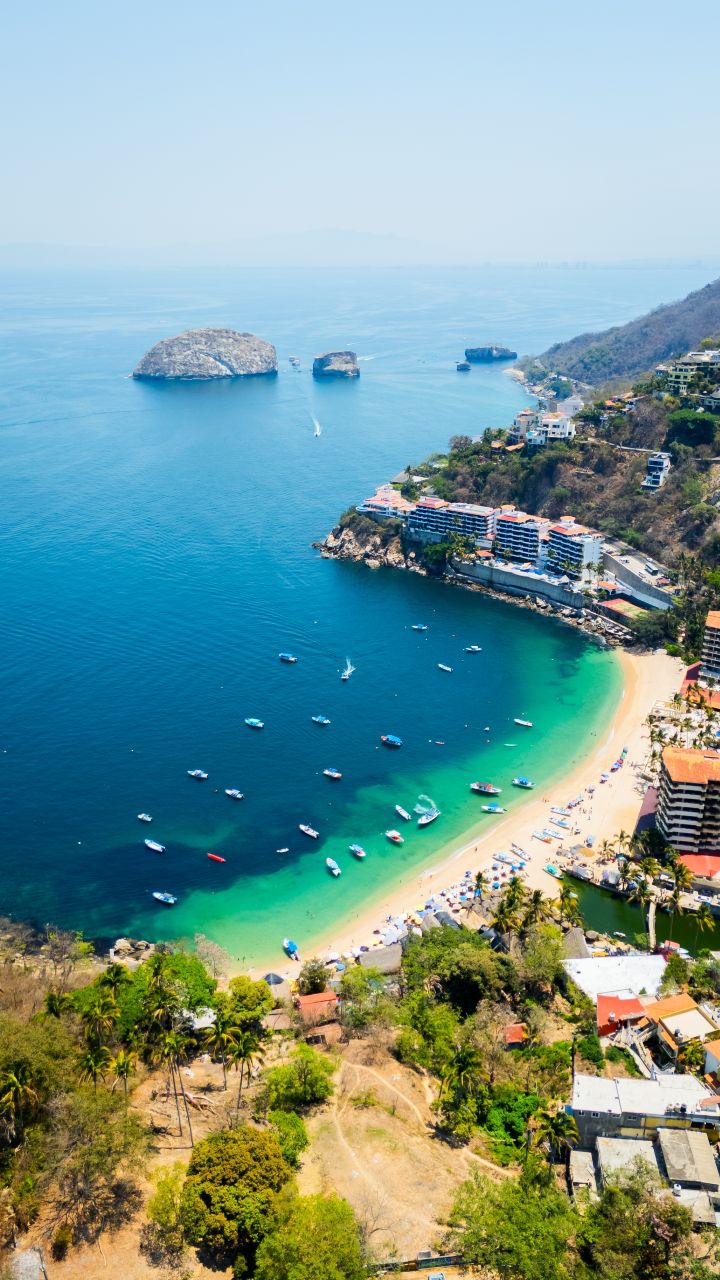 Car driving down rad in California with Hollywood hills in the back